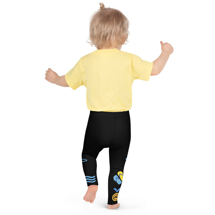 Aqua Kitty Winner Girls Leggings, black background with a blue and yellow swimmer cat wearing a diving mask and swim cap on one leg, golden medal and pool slippers below, "at the pool" text with water drop, and pool water with ladder on the other leg, back pose on model