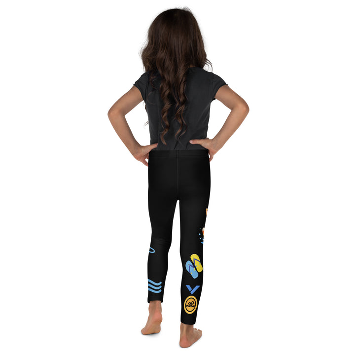 Aqua Kitty Winner Girls Leggings, black background with a blue and yellow swimmer cat wearing a diving mask and swim cap on one leg, golden medal and pool slippers below, "at the pool" text with water drop, and pool water with ladder on the other leg, back view on model