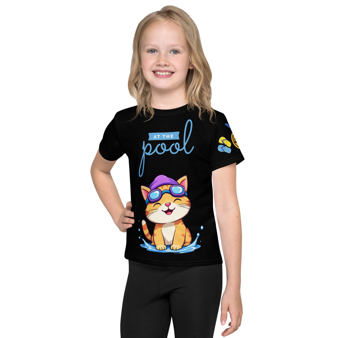 Aqua Kitty Winner Girls T-shirt, black background with a blue and yellow swimmer cat wearing diving goggles and a swim cap on the front, blue "At the pool" text above, water with drops below, golden medal and pool slippers on the left sleeve, and pool water waves with ladder on the back, front view on model