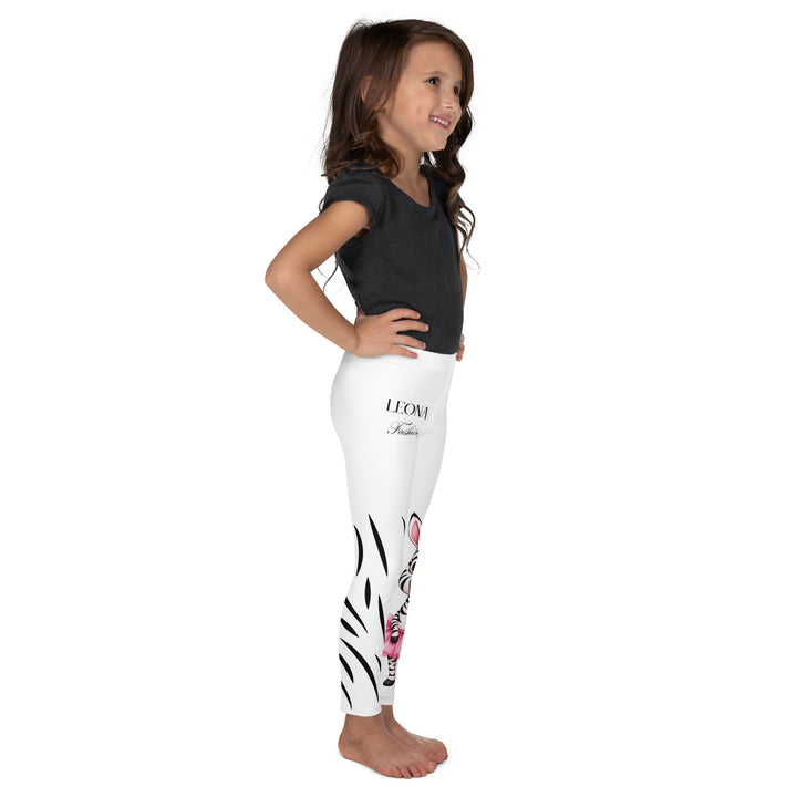 Ballet Black and White Zebra Girls Leggings, white background with a black and white zebra wearing a pink ballet skirt on the lower part of one leg, and black zebra stripes on the lower part of the other leg, right side view on model-with a visible 'Leona Fashion' text on the design