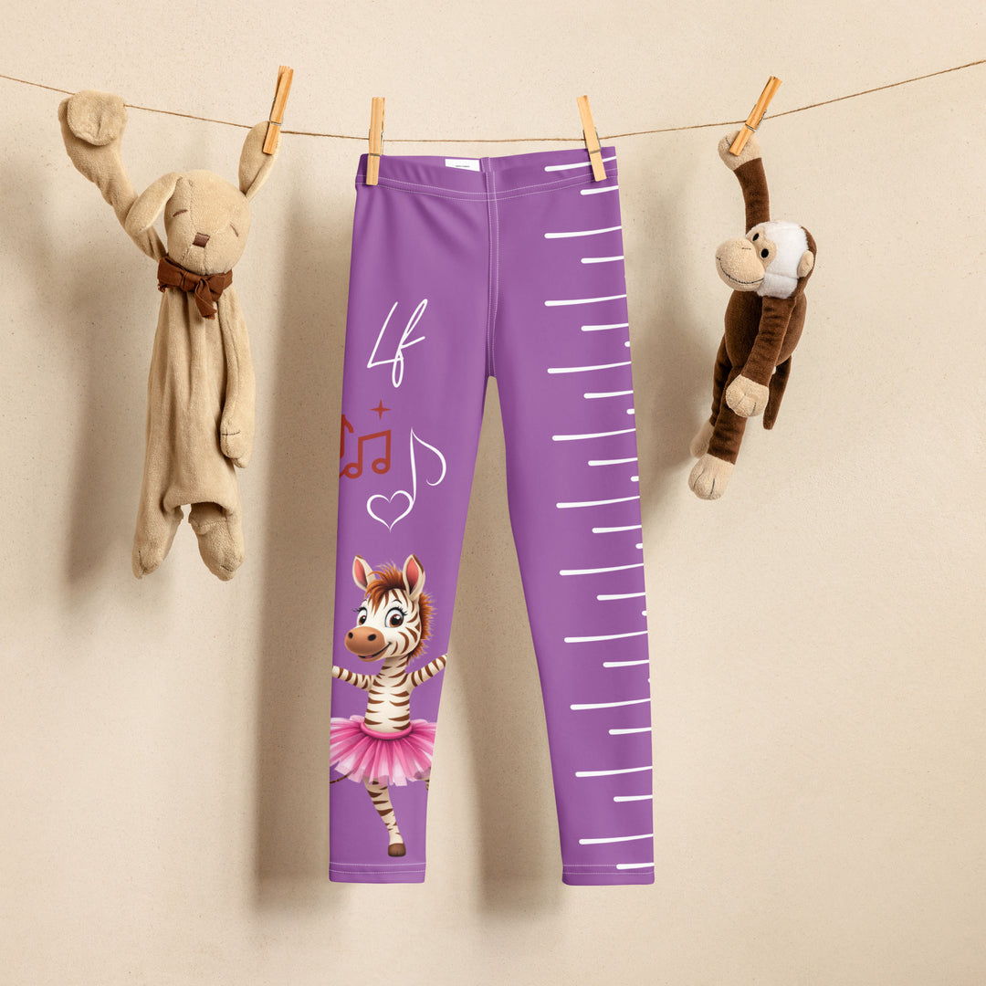  Ballet Sweet Zebra Girls Leggings, purple background with a brown and white zebra in a pink ballet skirt standing on one leg with arms extended, brown music notes above, and white vertical stripes running down the opposite leg, front view on hanger