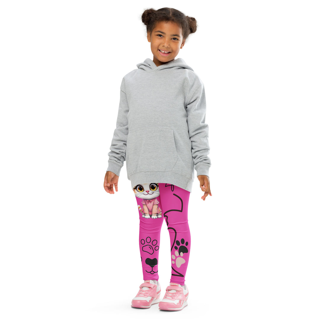 Cat Trace Girls Leggings, pink background with a yellow cat wearing a pink dress at the top of one leg, black paw prints and a black cat nose below, and a black line-drawn cat with black and cream paw prints on the other leg, front pose with arms at sides on model