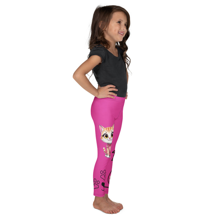 Cat Trace Girls Leggings, pink background with a yellow cat wearing a pink dress at the top of one leg, black paw prints and a black cat nose below, and a black line-drawn cat with black and cream paw prints on the other leg, right side view on model