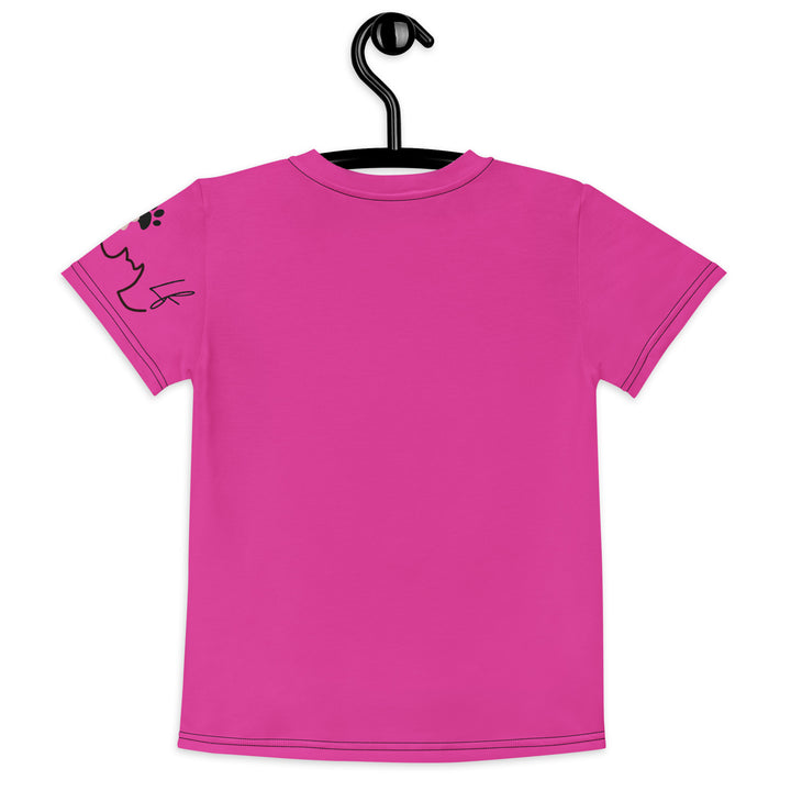 Cat Trace Girls T-shirt, pink background with a yellow cat sitting and wearing a light pink dress, with big eyes, long eyelashes, and a smiling expression on the front, and a black line-drawn cat with one black paw and one cream paw on the left sleeve, back view on hanger