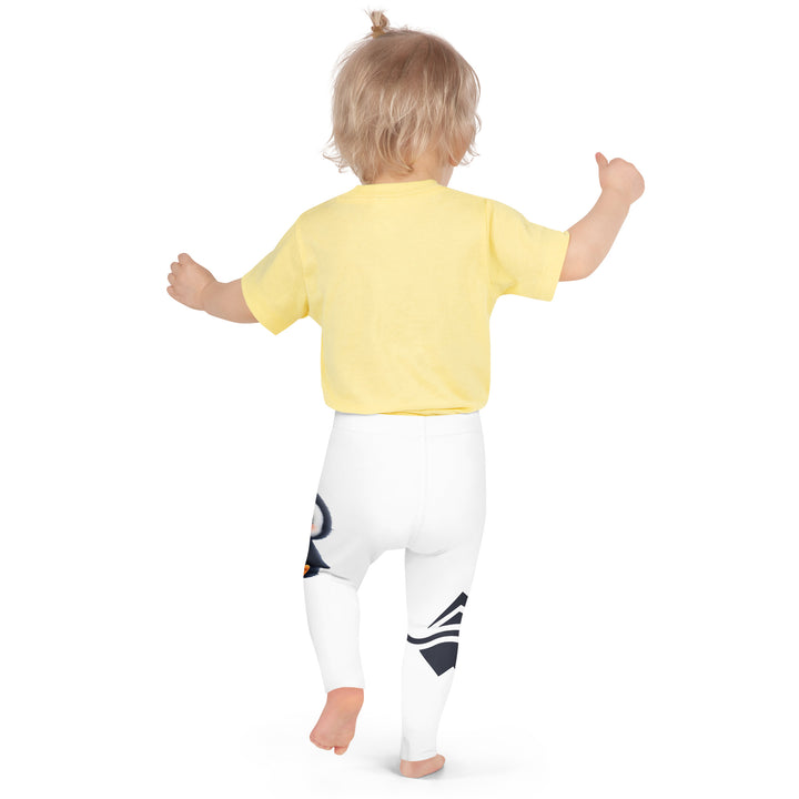 Chilly Penguin Girls Leggings, white background with a black and white small penguin sitting with green eyes on one leg, and a black and white iceberg with a wooden snow sign that says "NORTH POLE" on the other leg, back pose on model