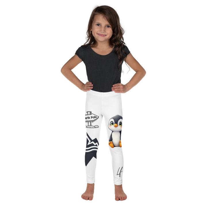 Chilly Penguin Girls Leggings, white background with a black and white small penguin sitting with green eyes on one leg, and a black and white iceberg with a wooden snow sign that says "NORTH POLE" on the other leg, front view on model