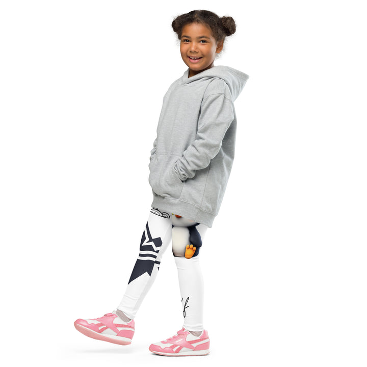 Chilly Penguin Girls Leggings, white background with a black and white small penguin sitting with green eyes on one leg, and a black and white iceberg with a wooden snow sign that says "NORTH POLE" on the other leg, side view with one leg lifted and extended on model