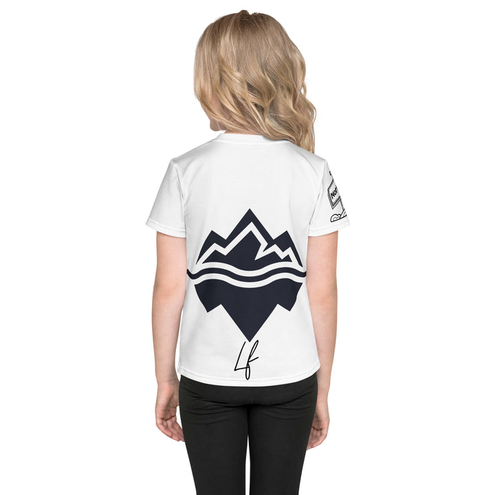 Chilly Penguin Girls T-shirt, white background with a black and white baby penguin sitting with green eyes on the front, a black line snow sign with "NORTH POLE" text on the left sleeve, and a black and white iceberg on the back, back view on model