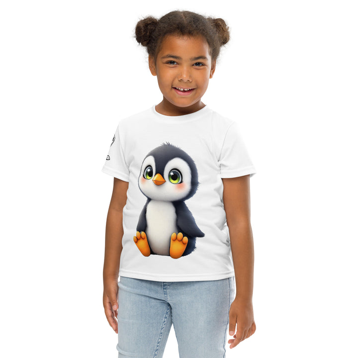 Chilly Penguin Girls T-shirt, white background with a black and white baby penguin sitting with green eyes on the front, a black line snow sign with "NORTH POLE" text on the left sleeve, and a black and white iceberg on the back, front pose with arms at sides on model