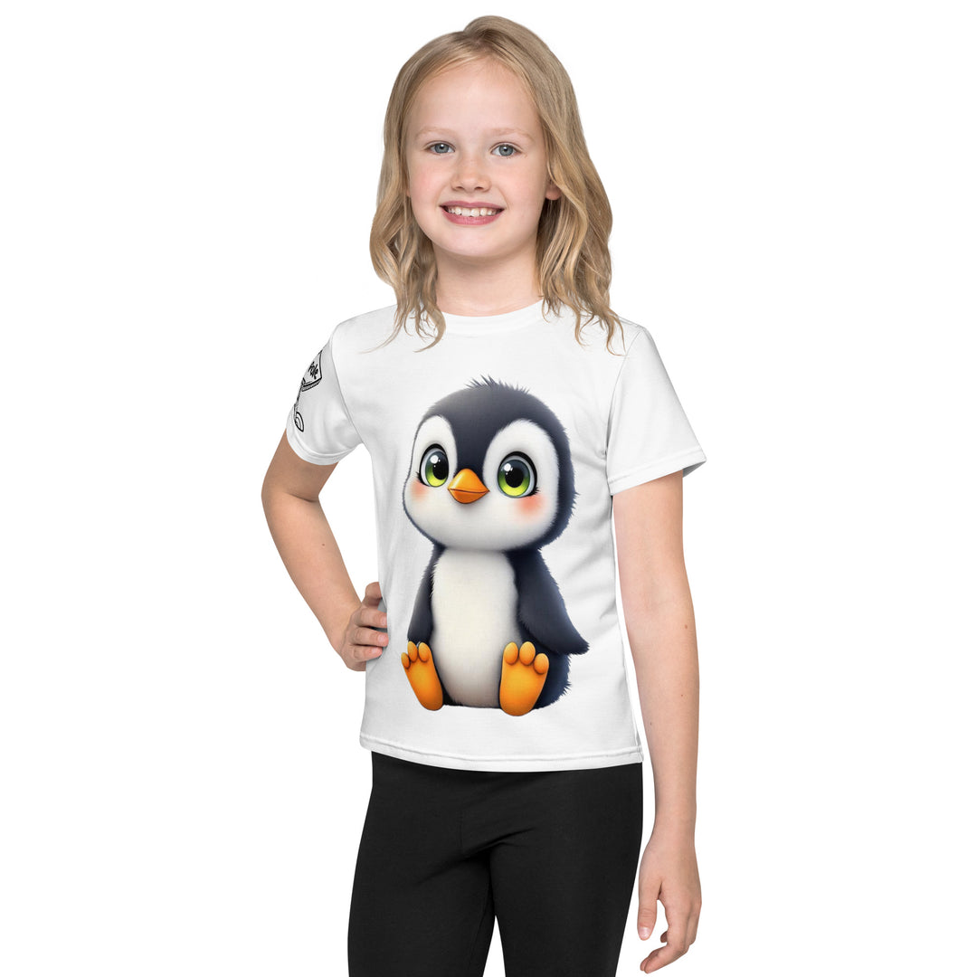 Chilly Penguin Girls T-shirt, white background with a black and white baby penguin sitting with green eyes on the front, a black line snow sign with "NORTH POLE" text on the left sleeve, and a black and white iceberg on the back, front view on model