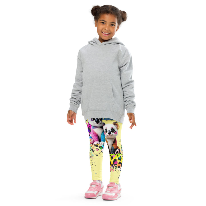 ColorSplash Panda Girls Leggings, yellow background with a colorful koala on each leg, featuring a vibrant tiger-striped design blending into the yellow background, partial yellow areas, front pose with arms at sides on model