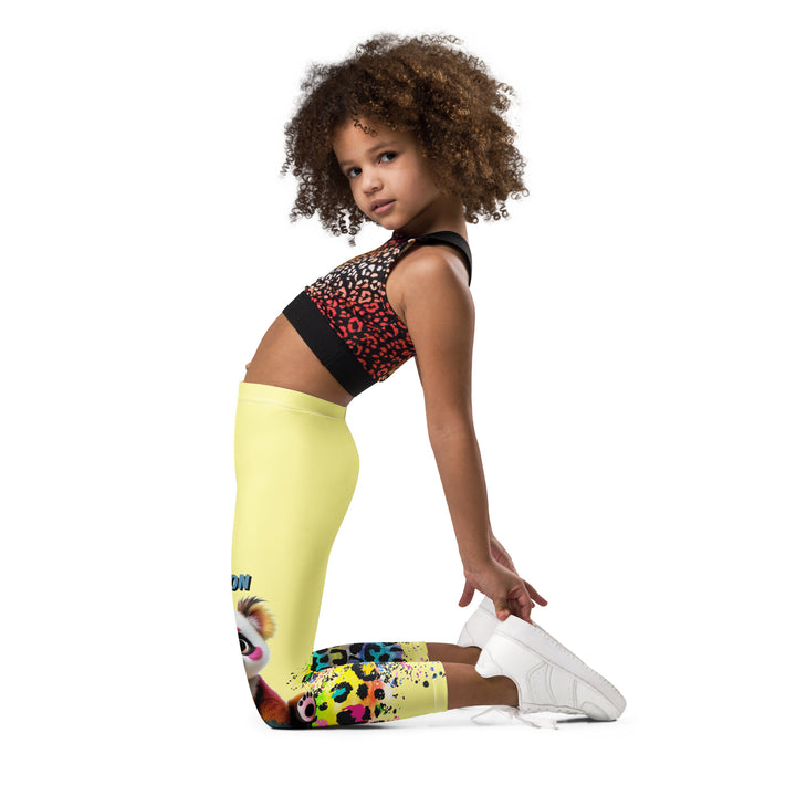  ColorSplash Panda Girls Leggings, yellow background with a colorful koala on each leg, featuring a vibrant tiger-striped design blending into the yellow background, partial yellow areas, left side view kneeling on model