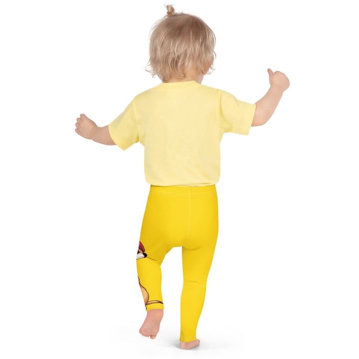 Cool Meerkat Girls Leggings, yellow background with a meerkat wearing a red cap on one leg and a paw graphic on the other leg appearing to come through the fabric, back pose on model