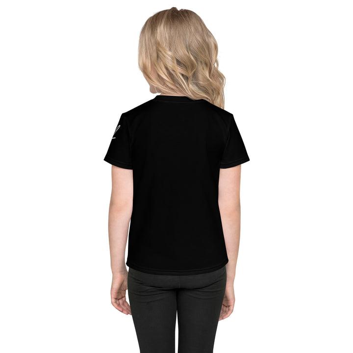  Coral Dolphin Girls T-shirt, black background with a pink baby dolphin sitting on a white cloud surrounded by small sparkling yellow stars, back view on model