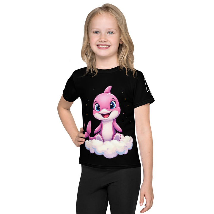 Coral Dolphin Girls T-shirt, black background with a pink baby dolphin sitting on a white cloud surrounded by small sparkling yellow stars, front view on model