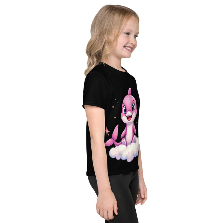 Coral Dolphin Girls T-shirt, black background with a pink baby dolphin sitting on a white cloud surrounded by small sparkling yellow stars, right side view on model