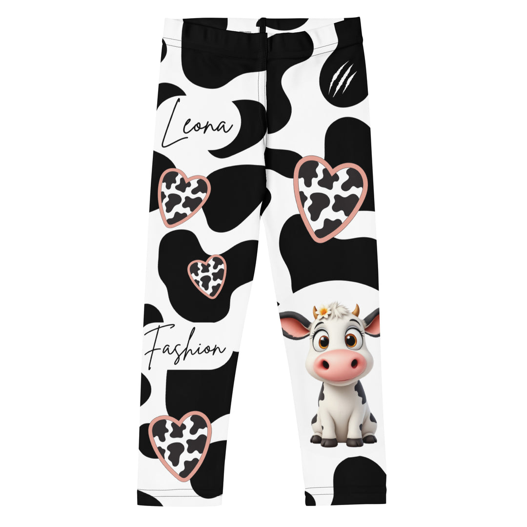  Cowlicious Love Girls Leggings, white background with black cow-like spots and a small black and white cow with a flower in its hair on one leg, front view-with a visible 'Leona Fashion' text on the design