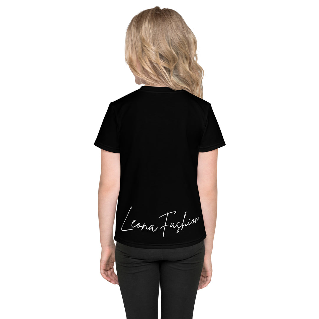 Cowlicious Love Girls T-shirt, black background with a black and white cow featuring a flower in its hair on the front, and a black and white cow-print heart outlined in pink behind it, back view on model-with a visible 'Leona Fashion' text on the design