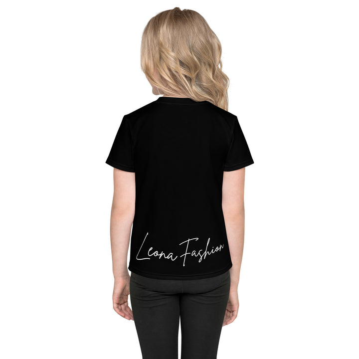 Cowlicious Love Girls T-shirt, black background with a black and white cow featuring a flower in its hair on the front, and a black and white cow-print heart outlined in pink behind it, back view on model-with a visible 'Leona Fashion' text on the design