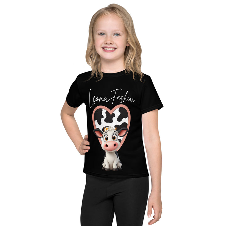  Cowlicious Love Girls T-shirt, black background with a black and white cow featuring a flower in its hair on the front, and a black and white cow-print heart outlined in pink behind it, front view on model-with a visible 'Leona Fashion' text on the design