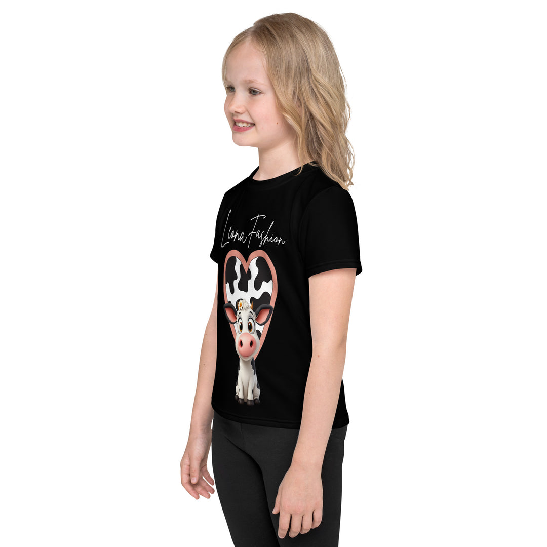 Cowlicious Love Girls T-shirt, black background with a black and white cow featuring a flower in its hair on the front, and a black and white cow-print heart outlined in pink behind it, left side view on model-with a visible 'Leona Fashion' text on the design