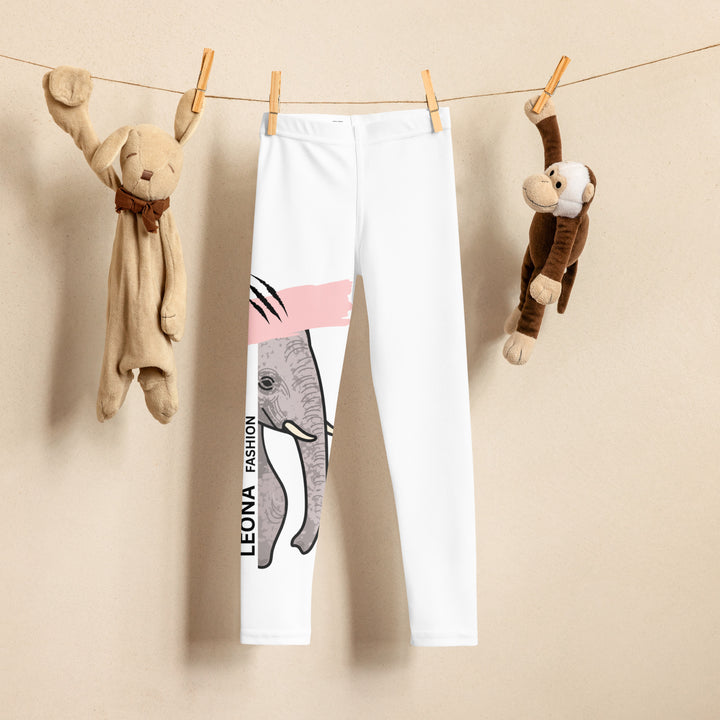 Elephant Whispers Girls Leggings, white background with gray elephant in profile on one leg, visible trunk, and soft blush pink stripe detail across the head, front view on hanger-with a visible 'Leona Fashion' text on the design
