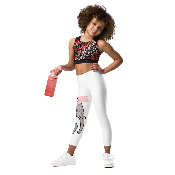  Elephant Whispers Girls Leggings, white background with gray elephant in profile on one leg, visible trunk, and soft blush pink stripe detail across the head, front view on model