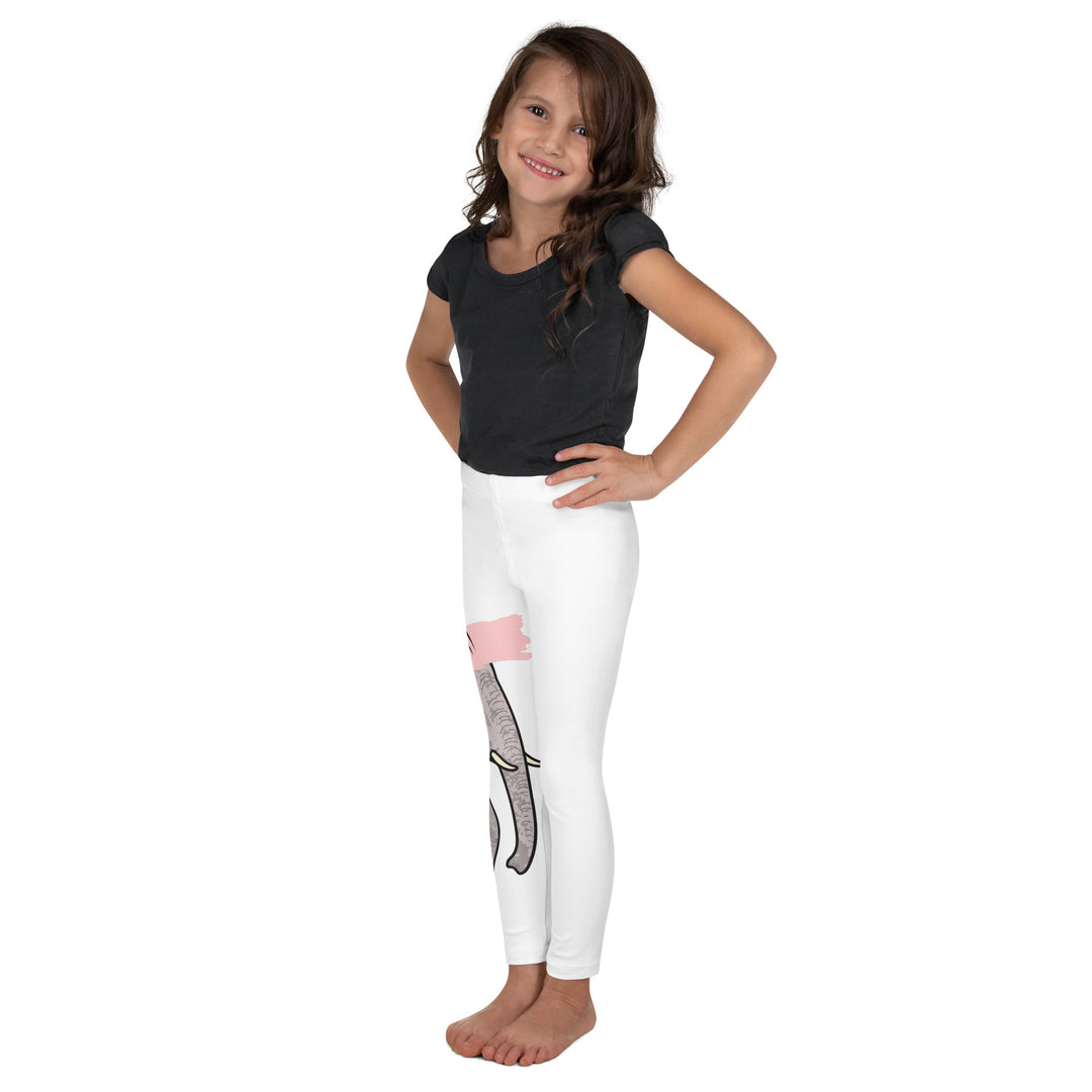 Elephant Whispers Girls Leggings, white background with gray elephant in profile on one leg, visible trunk, and soft blush pink stripe detail across the head, left side view on model
