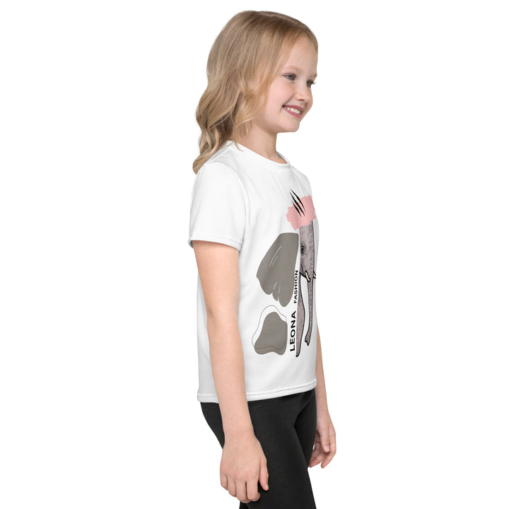 Elephant Whispers Girls T-shirt, white background with gray elephant in profile on one side, visible trunk, and soft blush pink stripe detail across the head, right side view on model-with a visible 'Leona Fashion' text on the design