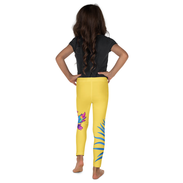 Fly Baby Parrot Girls Leggings, yellow background with a small pink baby parrot with spread wings on one leg, and a large blue tropical leaf with "I CAN DO IT" text in blue and pink letters above it on the other leg, back view on model