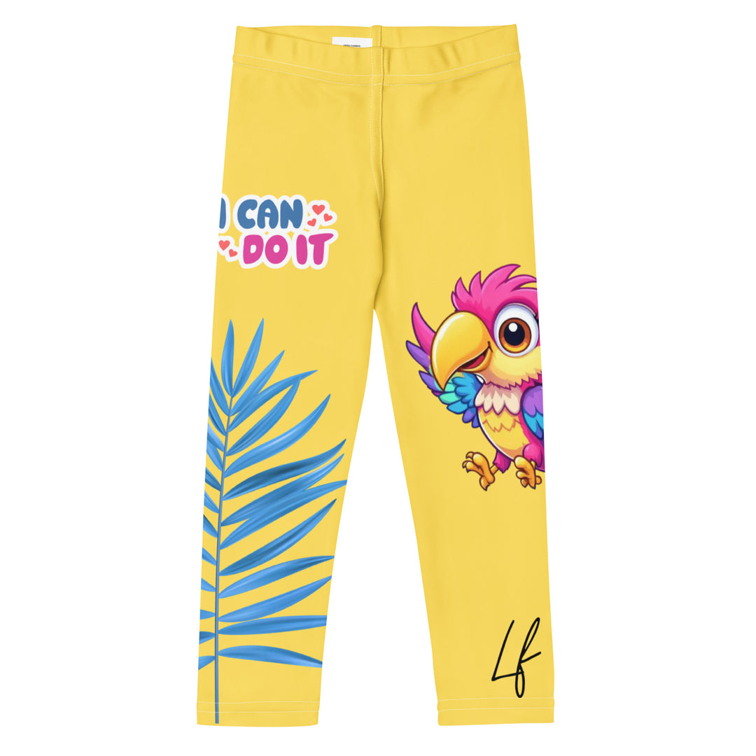 Fly Baby Parrot Girls Leggings, yellow background with a small pink baby parrot with spread wings on one leg, and a large blue tropical leaf with "I CAN DO IT" text in blue and pink letters above it on the other leg, front view