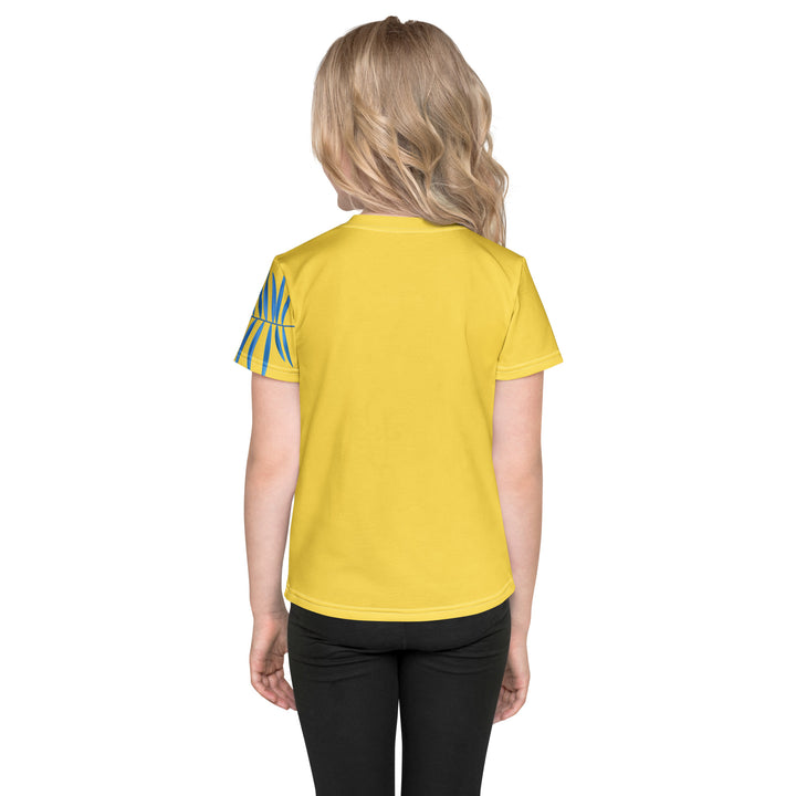 Fly Baby Parrot Girls T-shirt, yellow background with a small pink baby parrot with spread wings on the front, "I CAN DO IT" text in blue and pink letters below, and a blue tropical leaf on the left sleeve, back view on model