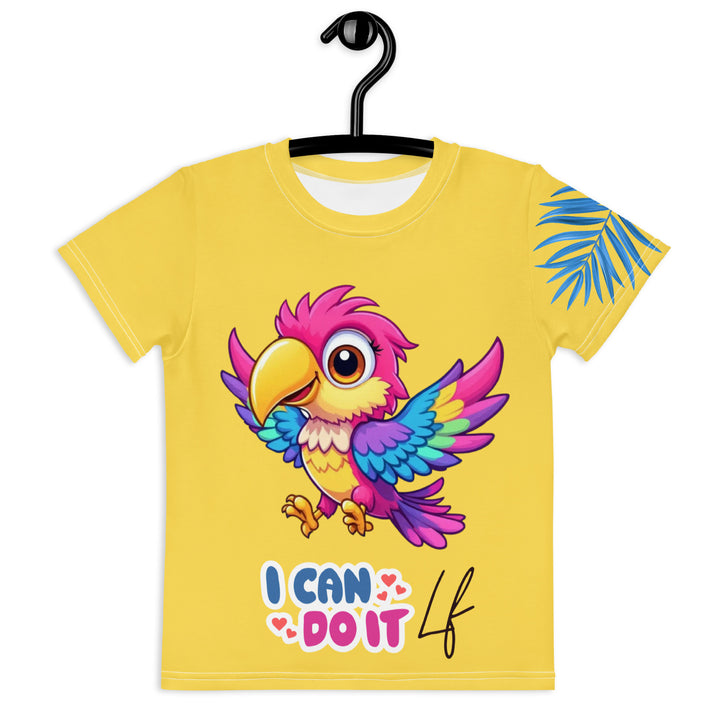 Fly Baby Parrot Girls T-shirt, yellow background with a small pink baby parrot with spread wings on the front, "I CAN DO IT" text in blue and pink letters below, and a blue tropical leaf on the left sleeve, front view on hanger
