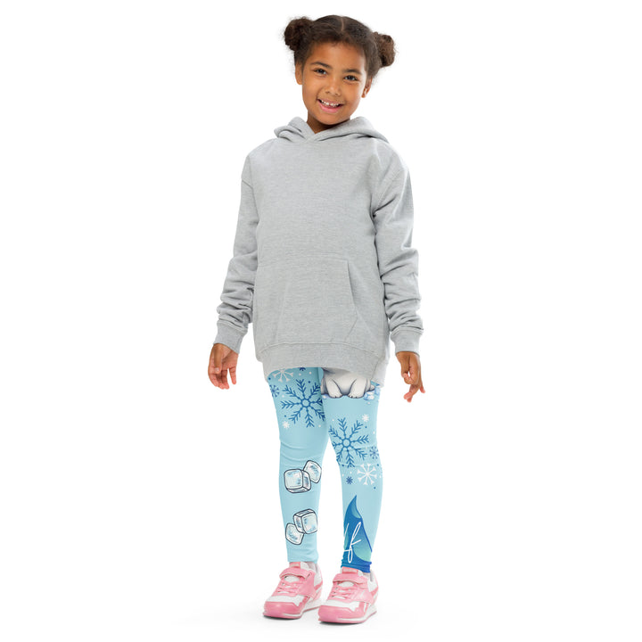  Frosty Seal Girls Leggings, light sky blue background with a white baby seal, blue and white snowflakes, and an ice block on one leg, and blue and white ice cubes with snowflakes on the other leg, front pose with arms at sides on model