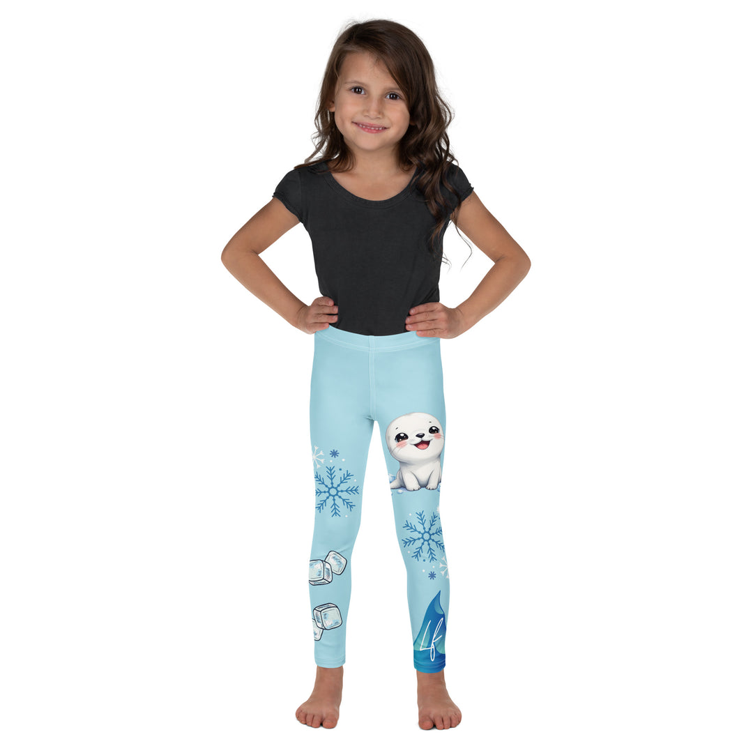 Frosty Seal Girls Leggings, light sky blue background with a white baby seal, blue and white snowflakes, and an ice block on one leg, and blue and white ice cubes with snowflakes on the other leg, front view on model