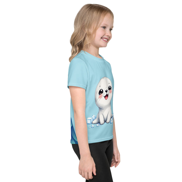 Frosty Seal Girls T-shirt, light sky blue background with a white baby seal surrounded by ice cubes on the front, blue and white snowflakes on the left sleeve, and an icy blue iceberg on the back, right side view on model