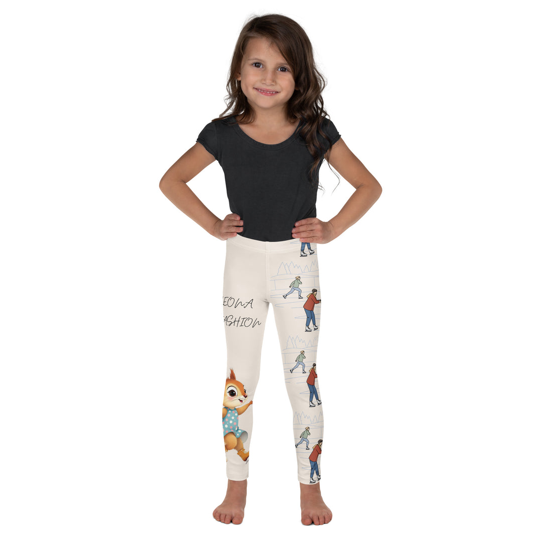 Frosty Twirl Squirrel Girls Leggings, beige background with a brown squirrel ice skating in a blue polka dot dress on one leg, ice trail lines, mountains, and small ice skaters along the other leg, in blue, brown, and orange tones, front view on model-with a visible 'Leona Fashion' text on the design