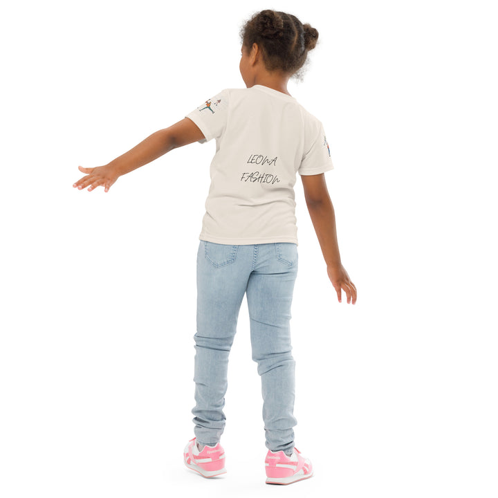  Frosty Twirl Squirrel Girls T-shirt, beige background with a brown squirrel ice skating in a blue polka dot dress on the front, ice trail lines on the sleeves, mountains and ice skaters on the back, in blue, brown, and orange tones, back angle with relaxed pose on model-with a visible 'Leona Fashion' text on the design
