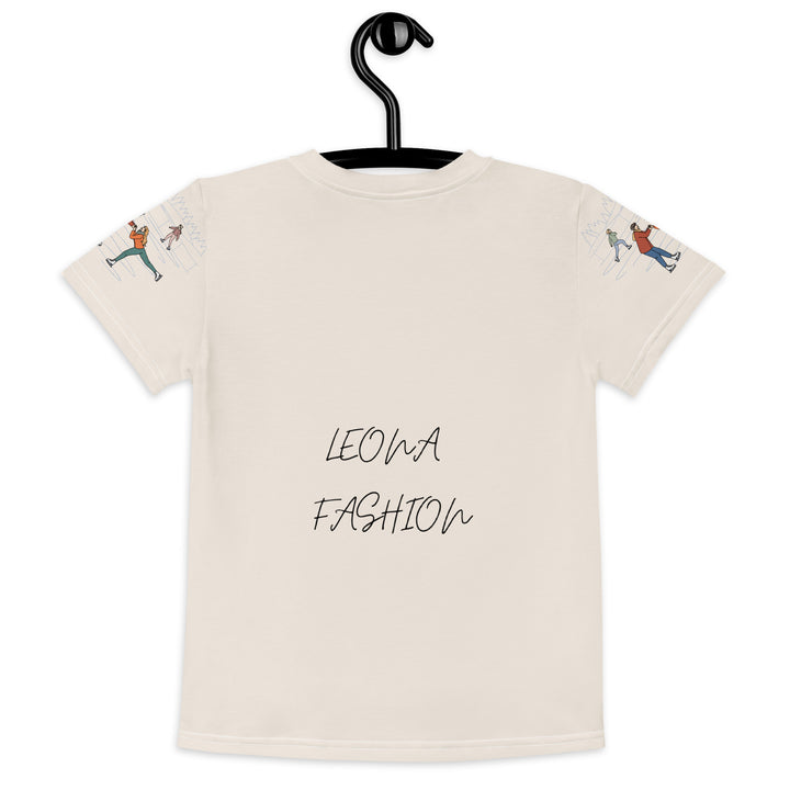 Frosty Twirl Squirrel Girls T-shirt, beige background with a brown squirrel ice skating in a blue polka dot dress on the front, ice trail lines on the sleeves, mountains and ice skaters on the back, in blue, brown, and orange tones, back view on hanger-with a visible 'Leona Fashion' text on the design