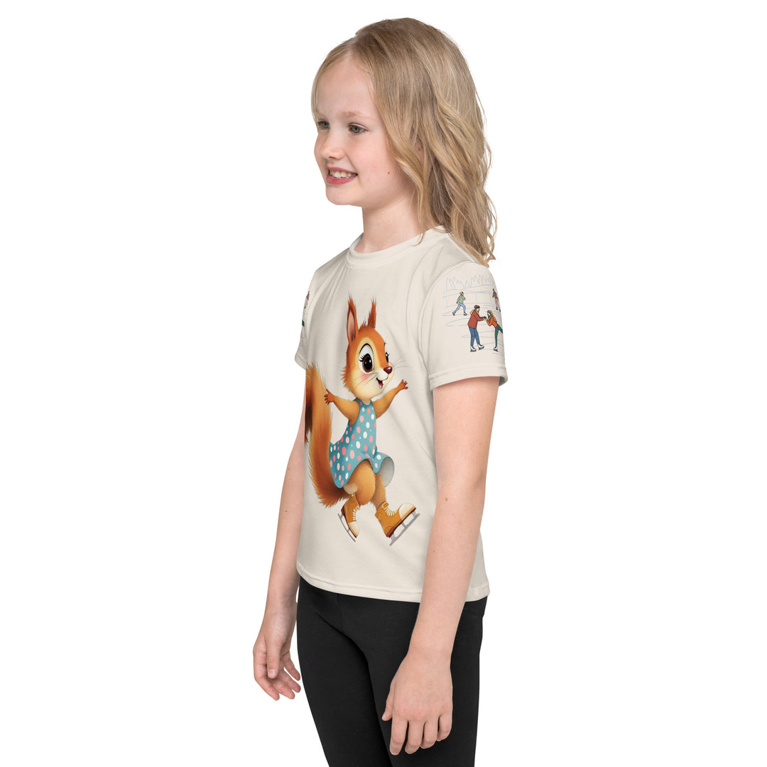 Frosty Twirl Squirrel Girls T-shirt, beige background with a brown squirrel ice skating in a blue polka dot dress on the front, ice trail lines on the sleeves, mountains and ice skaters on the back, in blue, brown, and orange tones, left side view on model