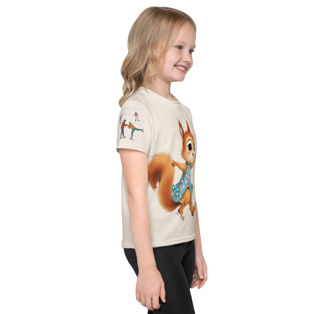 Frosty Twirl Squirrel Girls T-shirt, beige background with a brown squirrel ice skating in a blue polka dot dress on the front, ice trail lines on the sleeves, mountains and ice skaters on the back, in blue, brown, and orange tones, right side view on model