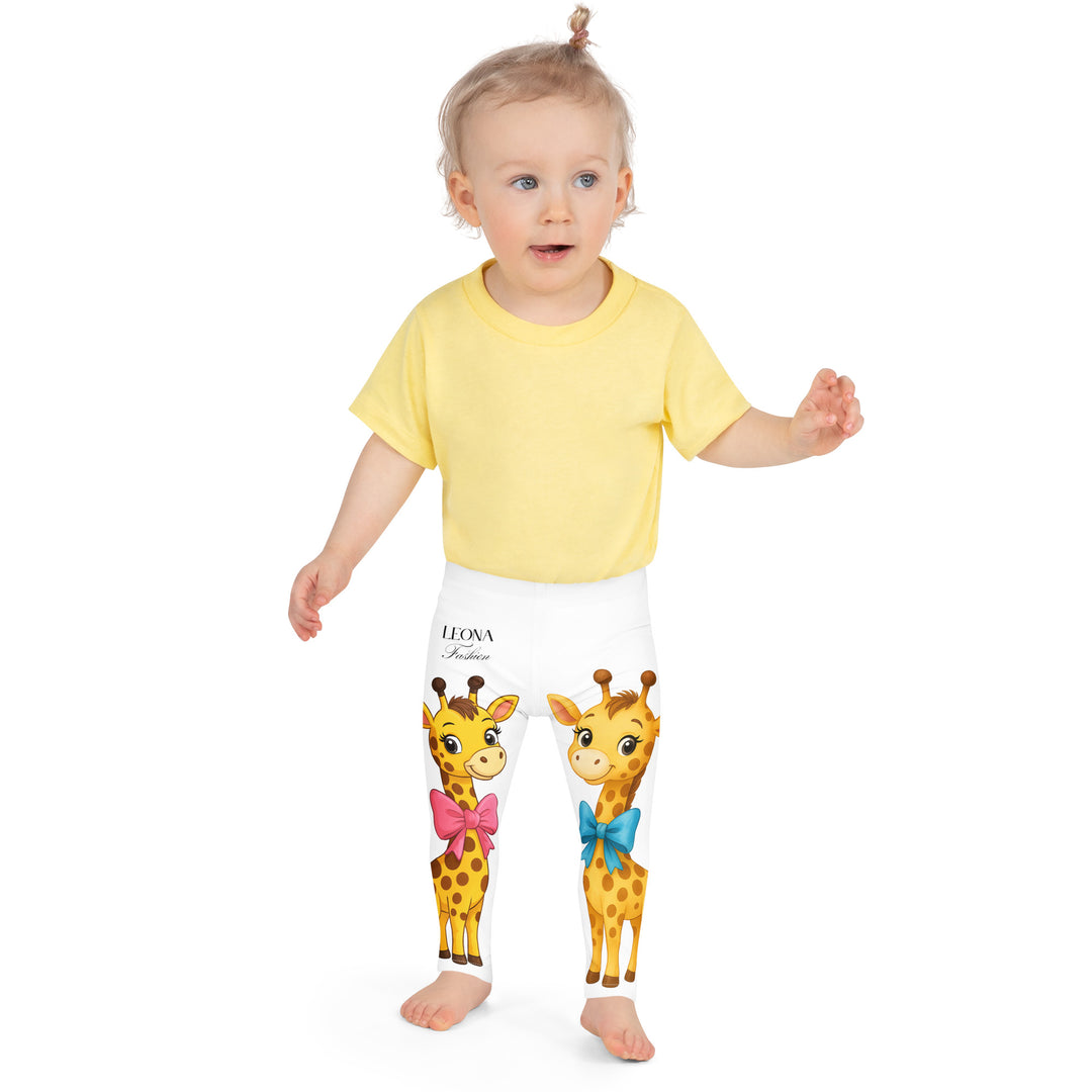 Giraffe Love Girls Leggings, white background with a full-length girl giraffe wearing a big pink bow around her neck on one leg, and a full-length boy giraffe with a blue bow around his neck on the other leg, front close-up view on model