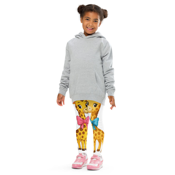  Giraffe Love Girls Leggings, white background with a full-length girl giraffe wearing a big pink bow around her neck on one leg, and a full-length boy giraffe with a blue bow around his neck on the other leg, front pose with arms at sides on model