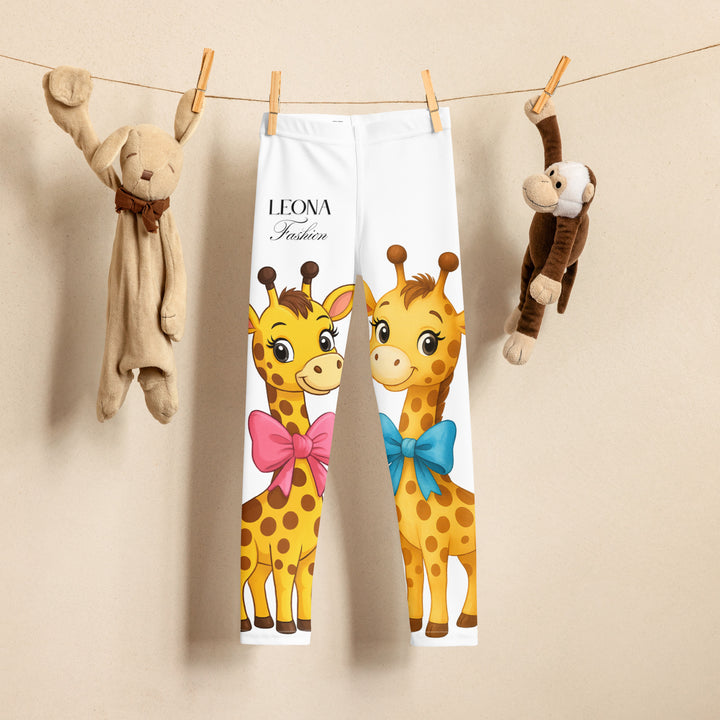  Giraffe Love Girls Leggings, white background with a full-length girl giraffe wearing a big pink bow around her neck on one leg, and a full-length boy giraffe with a blue bow around his neck on the other leg, front view on hanger