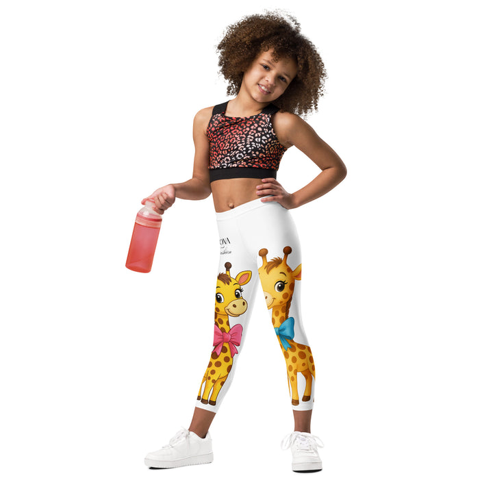  Giraffe Love Girls Leggings, white background with a full-length girl giraffe wearing a big pink bow around her neck on one leg, and a full-length boy giraffe with a blue bow around his neck on the other leg, relaxed front pose on model