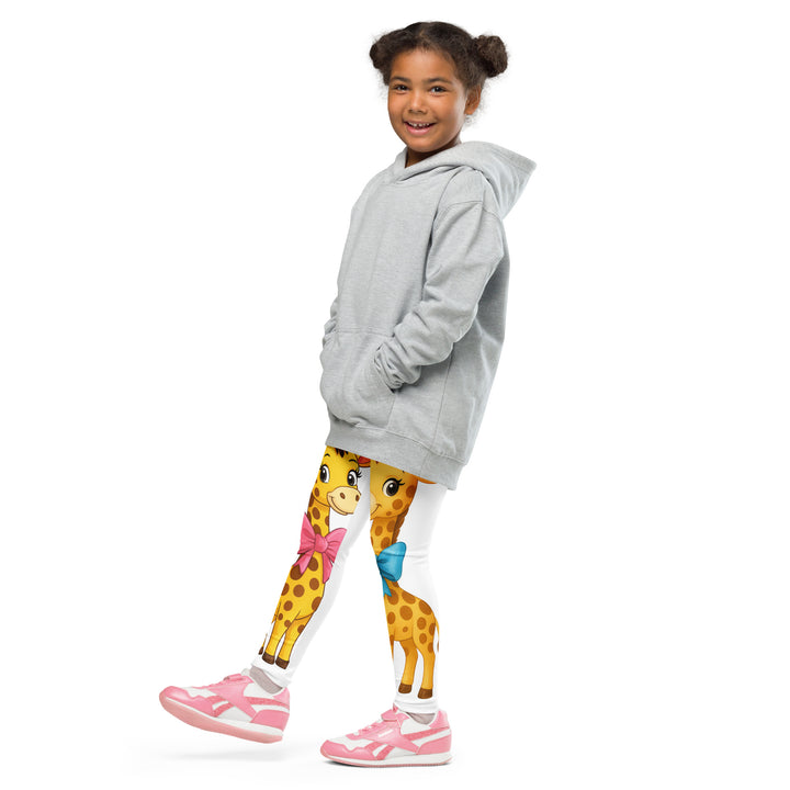 Giraffe Love Girls Leggings, white background with a full-length girl giraffe wearing a big pink bow around her neck on one leg, and a full-length boy giraffe with a blue bow around his neck on the other leg, side view with one leg lifted and extended on model
