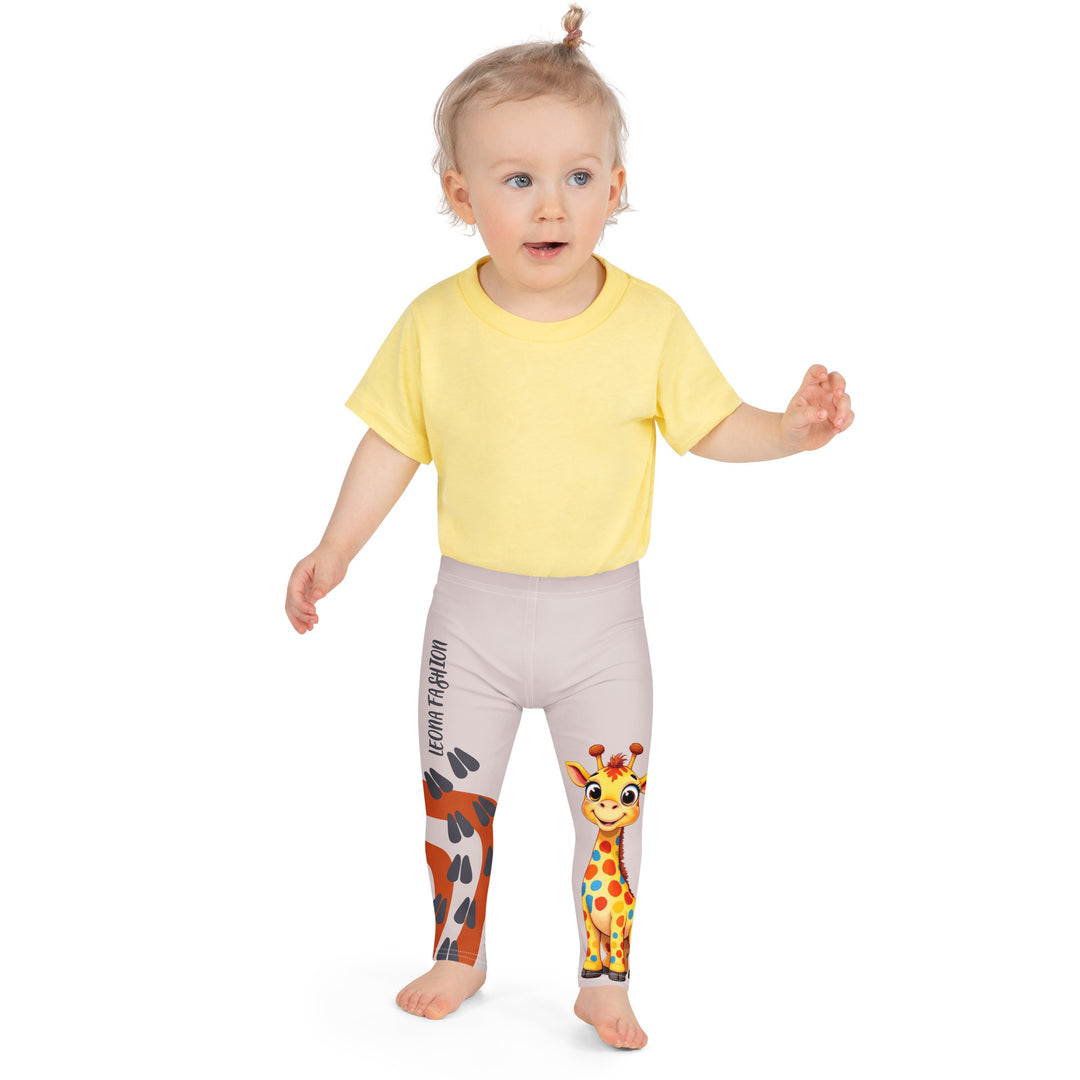 Giraffe Path Girls Leggings, cream background with a yellow giraffe featuring colorful polka dots on one leg, and orange-brown spots with dark gray giraffe footprints on the other leg, both designs starting from above the knee down, front close-up view on model-with a visible 'Leona Fashion' text on the design