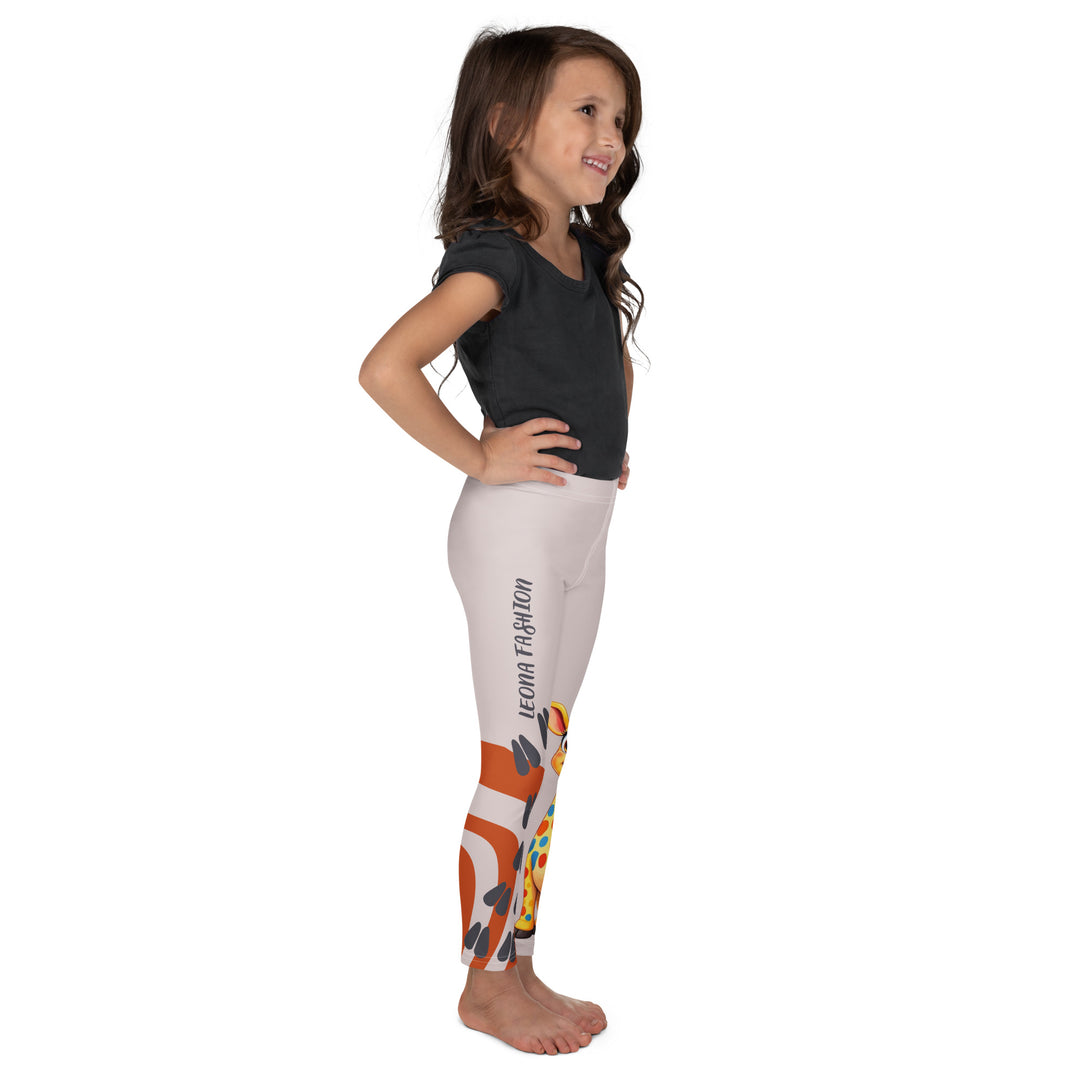 Giraffe Path Girls Leggings, cream background with a yellow giraffe featuring colorful polka dots on one leg, and orange-brown spots with dark gray giraffe footprints on the other leg, both designs starting from above the knee down, right side view on model-with a visible 'Leona Fashion' text on the design