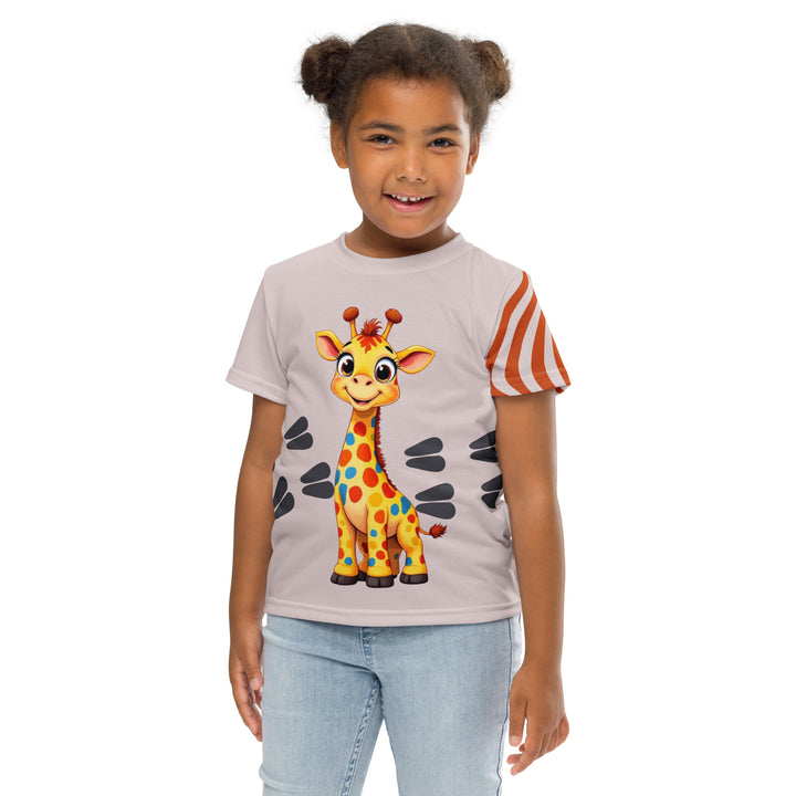  Giraffe Path Girls T-shirt, cream background with a smiling yellow giraffe featuring colorful polka dots on the front, dark gray giraffe paw prints behind, and brown-orange wavy lines on the left sleeve, front pose with arms at sides on model