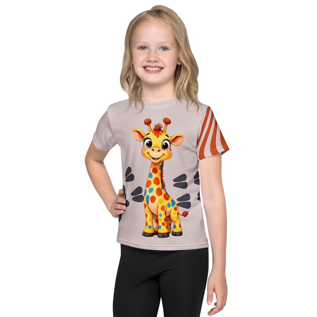 Giraffe Path Girls T-shirt, cream background with a smiling yellow giraffe featuring colorful polka dots on the front, dark gray giraffe paw prints behind, and brown-orange wavy lines on the left sleeve, front view on model